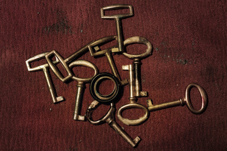 A group of old gold keys closeupの写真素材