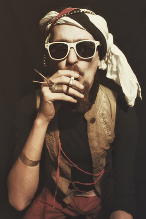 Portrait of young man wearing a stylish sunglasses