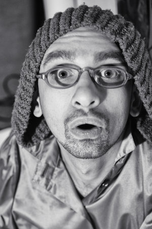 Funny Portrait a surprised silly young  man wearing eyeglasses