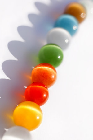 Multicolored bright glass beads on white backgroundの写真素材