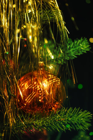 Christmas tree decorations against the backdrop of colorful blurred spotsの写真素材