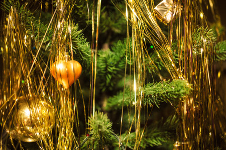 Christmas tree decorations against the backdrop of colorful blurred spotsの写真素材