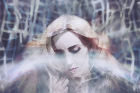 Dreamy portrait of a beautiful young womanの写真素材