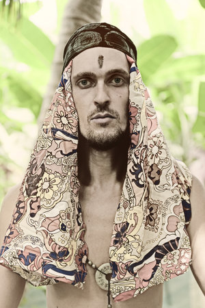 Portrait of young man wearing a headdress in Arabic styleの写真素材
