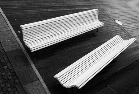 Two empty benches view from the topの写真素材