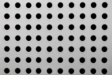 Metal texture with round holes close upの写真素材