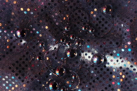 dark Silver beads on shiny bright cloth mirrors closeupの写真素材