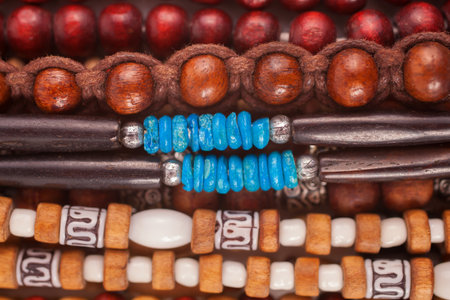 A group of Ethnic wooden bracelets and necklaces close-upの写真素材