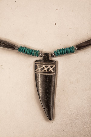 Wooden necklace with mascot canine close-upの写真素材