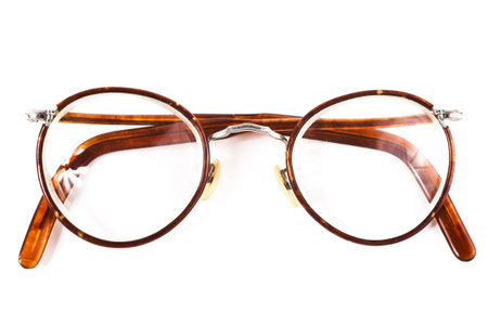 Old retro reading glasses isolated on white backgroundの写真素材