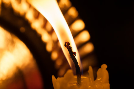 One burning candle in the dark. Macro shotの写真素材