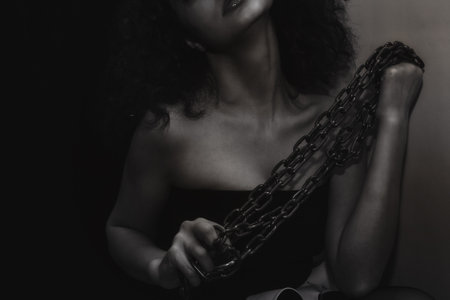 Portrait of a young woman with a metal chain closeup