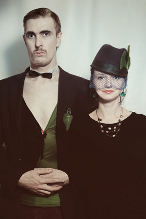 Young couple theater actors in a retro style on a light background. Vintageの写真素材