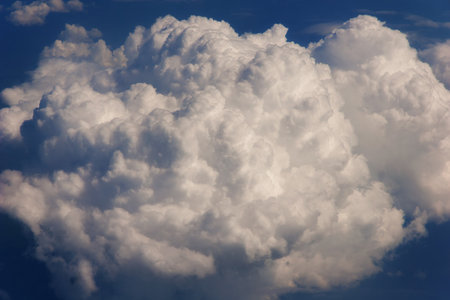 Aerial view from the airplane window to a fluffy cloud. Sky backroundの写真素材