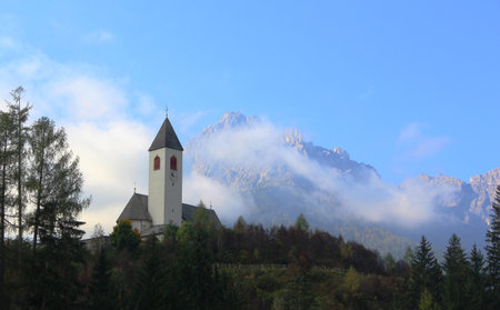 Catholic Church with foggy mountains behindの写真素材