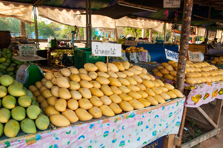 PRACHUAP KHIRI KHAN, THAILAND - APRIL 21, 2016: Fruit shop with many pile of mango in different kindのeditorial素材