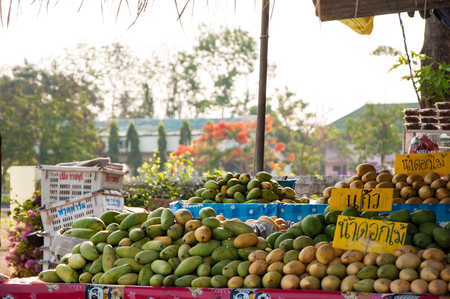 PRACHUAP KHIRI KHAN, THAILAND - APRIL 21, 2016: Fruit shop with many pile of mango in different kindのeditorial素材