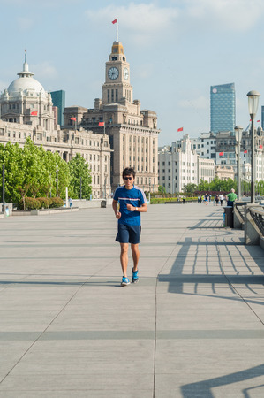 Shanghai, China - JUNE 4, 2017 : man running at Shanghai bund in the morning,landmark of Shanghaiのeditorial素材