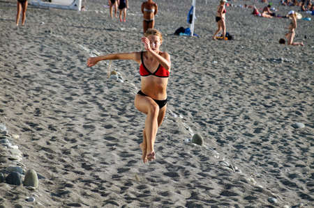 young girl athlete performs a running exerciseのeditorial素材
