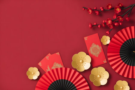 Chinese new year celebration background with traditional red envelopes, golden flowers, and decorative fans on a vibrant red surfaceの素材