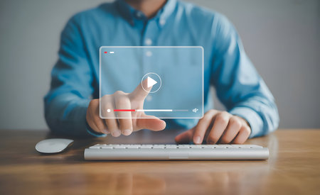 Man's hand interacting with a holographic video player interface, streaming online multimedia content, digital entertainment, internet technology.の素材