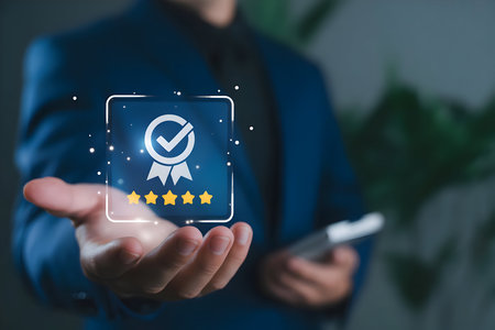 Businessman presenting virtual quality badge with checkmark and five stars, symbolizing excellent customer service, high rating, and guarantee.の素材