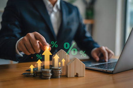 Hand touching glowing arrow, symbolizing real estate investment growth, property value appreciation and financial interest rates.の素材