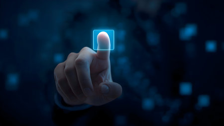 Human finger touching digital interface with glowing blue square, representing security, authentication, technology, and futuristic interaction.の素材