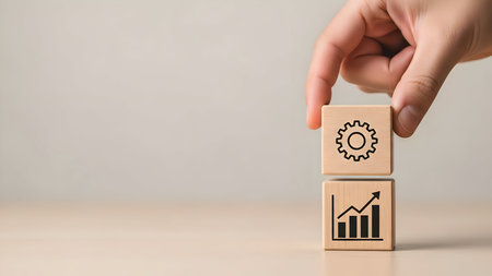 Hand placing gear block atop growth chart block, symbolizing strategic process optimization leading to business improvement and success.の素材