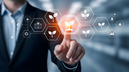 Businessman touching virtual screen with glowing plant icon, symbolizing sustainable business growth, environmental technology, and innovation for a greener future.の素材