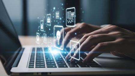 Digital transformation concept with hands typing on laptop. glowing icons represent innovation, data analysis, cybersecurity, and cloud tech.の素材