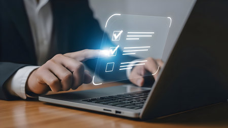 Man using a laptop with a glowing credit card and online shopping interface displayed on screenの素材