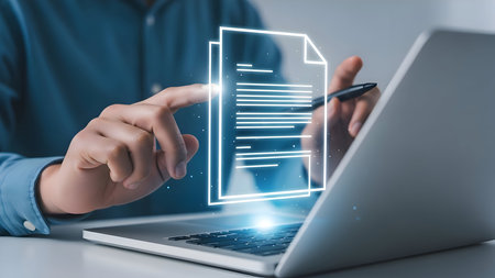 Man interacting with a digital document interface projected from a laptop screen in a modern officeの素材