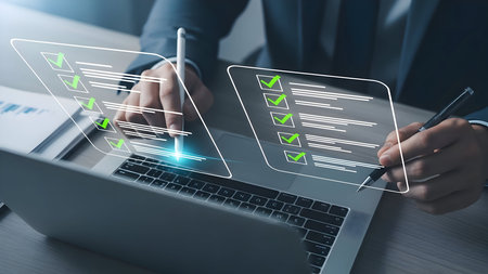 Businessman interacting with a transparent digital shopping cart interface over a laptopの素材
