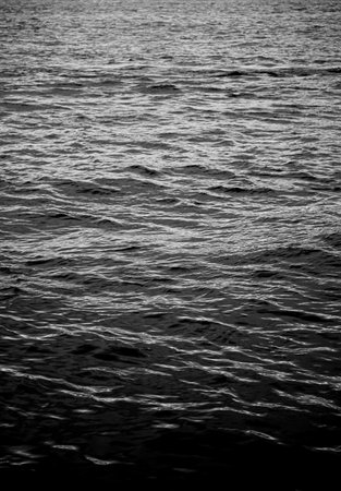 Reflect ripple water texture background. High resolution wallpaper of dark water. Abstract surface sea water in black and white photography.の写真素材