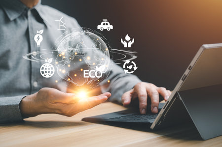 Businessman holding ECO global network connection metaverse. Green Energy world cycle technology, smart city, intelligence and IoT (Internet of Things)の写真素材