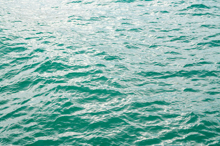Water view. Sea water background. Green blue ocean water texture background. Sea water and ripples....