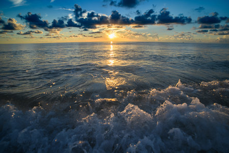 Sea with waves splashing and beach sand. Ocean wave seascape. Sea view for nature backgroundの写真素材
