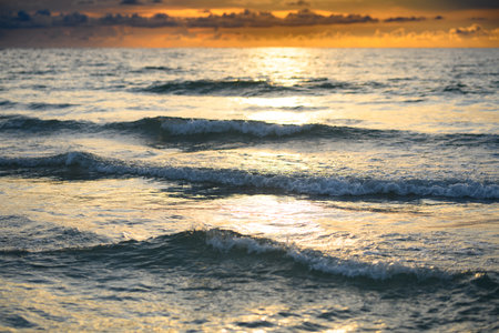 Ocean waves splashing. Ocean waves and beach background. Ocean or sea waves. Sky and clouds...