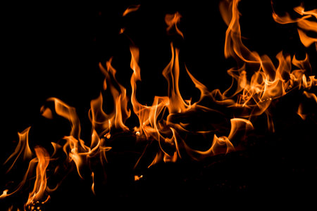 Fire flames on black background. Abstract blaze fire flame texture for banner background. Fire flames on black background. Fire flame texture.の写真素材