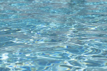 Blue water texture background. Background of pool water surface. Blue aqua water surface. Blue pool...