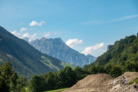 Switzerland Swiss Alps. Alpine pasture in mountains. Lake in the Swiss Alps. Panoramic view....