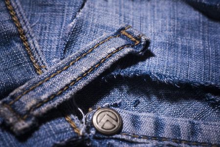 Jeans fabric texture. Blue denim jean background. Jeans texture or denim background. Jeans with pockets, rivets, buttons, seams.の写真素材