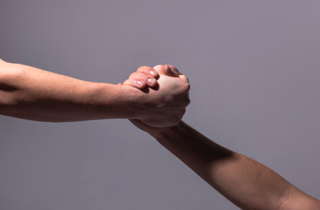 Support hands. Helping support hand of a friend.の写真素材