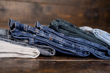 Jeans fabric texture. Blue denim jean background. Jeans texture or denim background. Jeans with pockets, rivets, buttons, seams.の写真素材