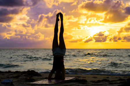 Young fit woman doing yoga exercises.