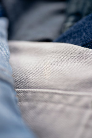 Closeup of jeans fabric. Jeans background. Denim texture. Denim texture for backdrop. Denim jeans texture. Jeans pattern for textured background.の写真素材