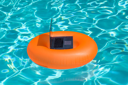 Laptop with blank screen. Summer business. Freelance style. Summer vacation concept. Remote online working. Freelance work. Online working background.の写真素材