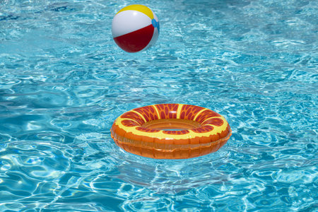 Summer background. Ring float in swimming pool. Summer background. Summer backdrop. Summertime vacation. Rubber circle. Inflatable swimming ring. Toy for water.の写真素材