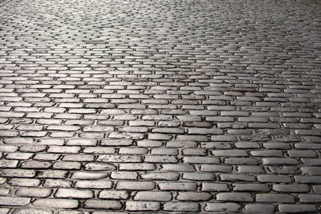 Cobblestone pavement background. Textured background of cobblestone road. Cobblestone pavement for background. Cobblestone road background.の写真素材